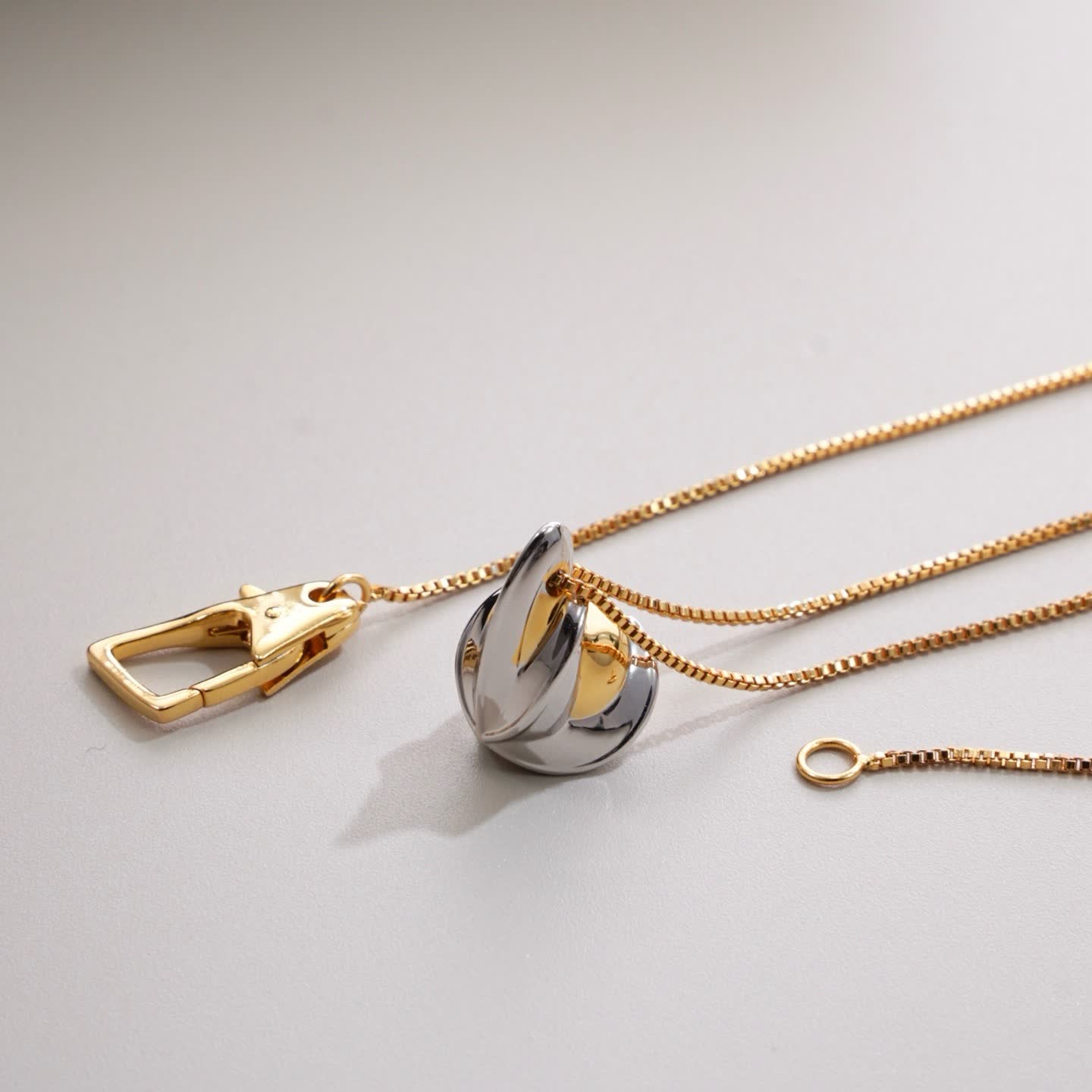 Bottega Veneta Elegant Gold and Silver Pendant Necklace